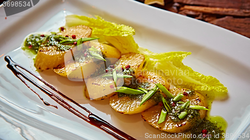 Image of appetizer of grilled celery with greens 