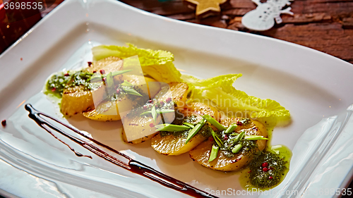 Image of appetizer of grilled celery with greens