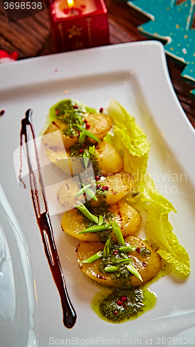 Image of appetizer of grilled celery with greens 