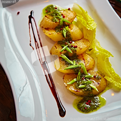 Image of appetizer of grilled celery with greens 