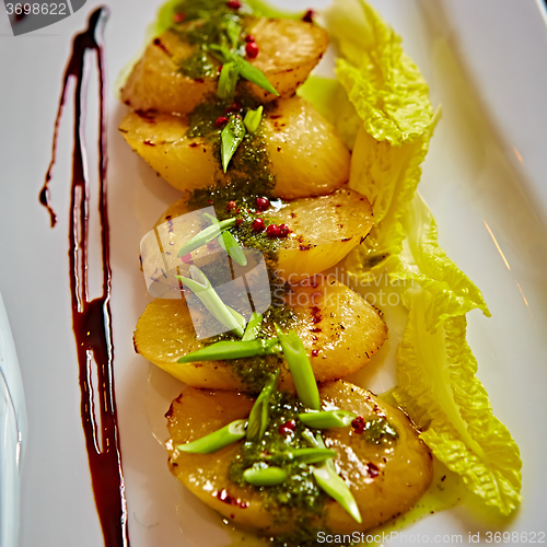 Image of appetizer of grilled celery with greens 