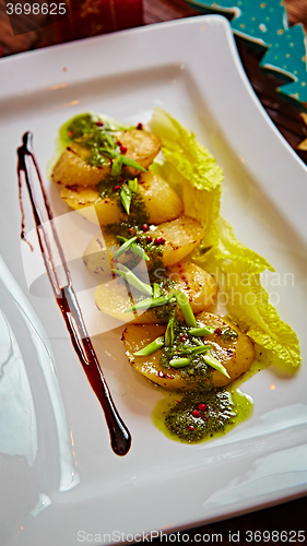 Image of appetizer of grilled celery with greens 