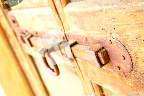 Image of europe old in  italy   door and rusty 