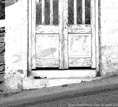 Image of blue door in antique village santorini greece europe and    whit