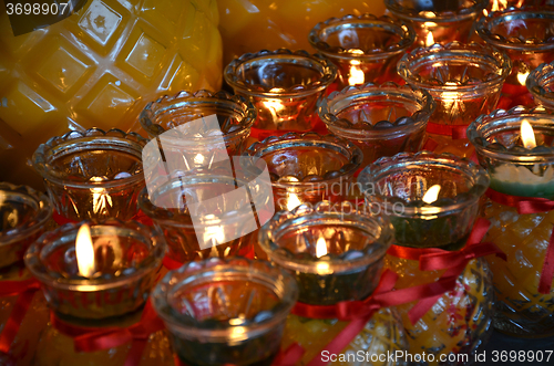 Image of Temple candles in transparent chandeliers