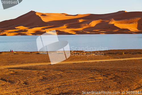 Image of sunshine in the lake yellow    sand and     dune