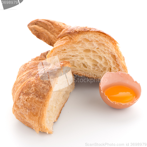 Image of Croissant and raw egg