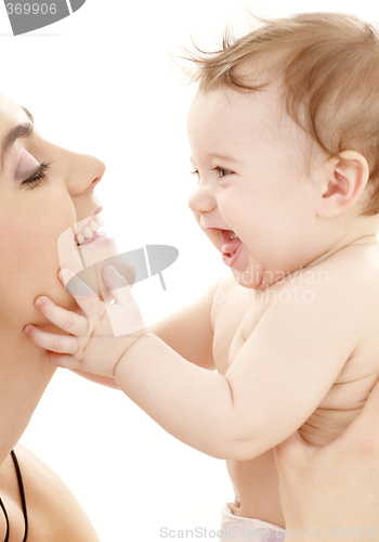 Image of happy cuddle with mother