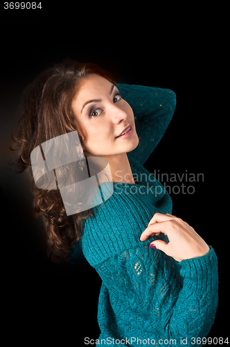 Image of Attractive red-haired womqn in sweater