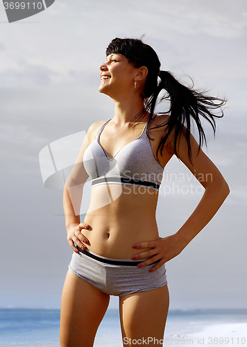 Image of happy woman in sport wear