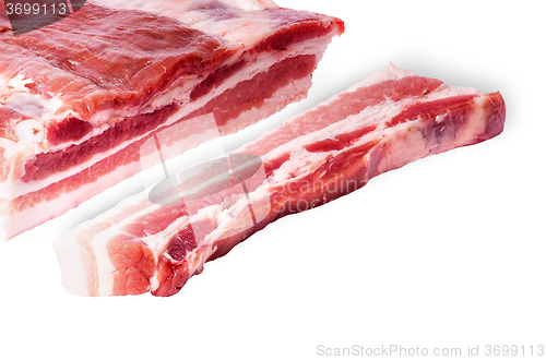 Image of Cut a piece of bacon next to a large