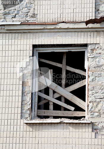 Image of Boarded window of old house