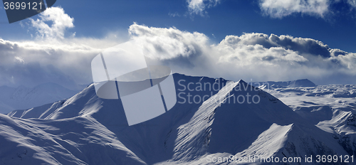 Image of Panoramic view on snow mountains in nice evening.