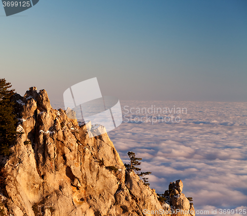 Image of Evening rocks and sea in clouds