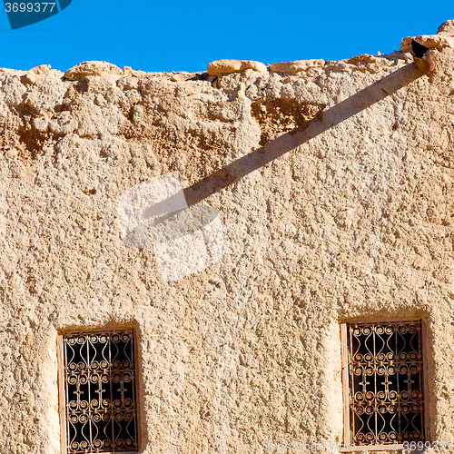 Image of   yellow window in morocco africa old construction and brown wal