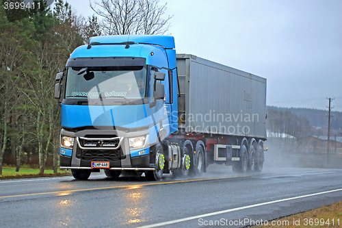 Image of Blue Renault Trucks T Delivers on Rainy Day