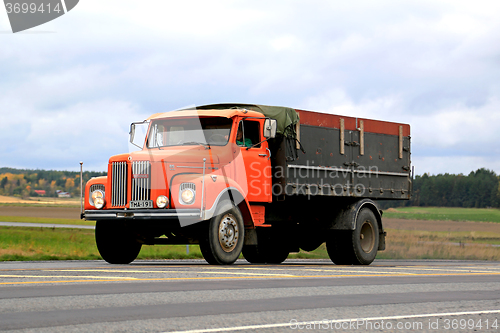 Image of Orange Scania L85 Super Truck on the Road