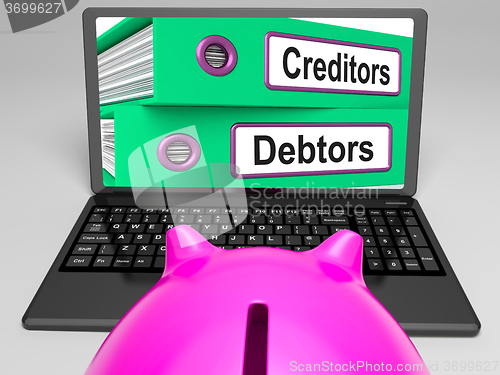 Image of Creditors And Debtors Files On Laptop Shows Financing