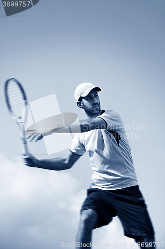 Image of male tennis player in action