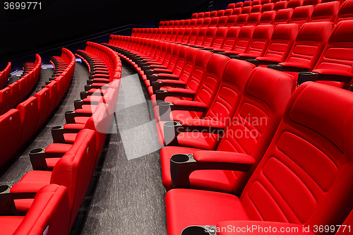 Image of Empty rows of red theater or movie seats