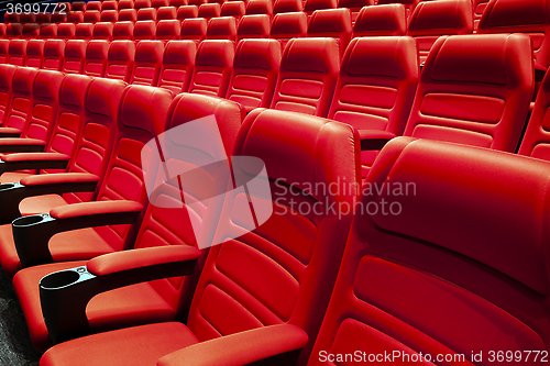 Image of Empty rows of red theater or movie seats