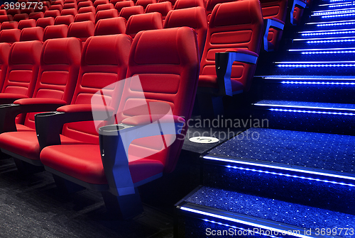 Image of Empty rows of red theater or movie seats