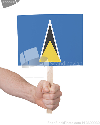 Image of Hand holding small card - Flag of Saint Lucia