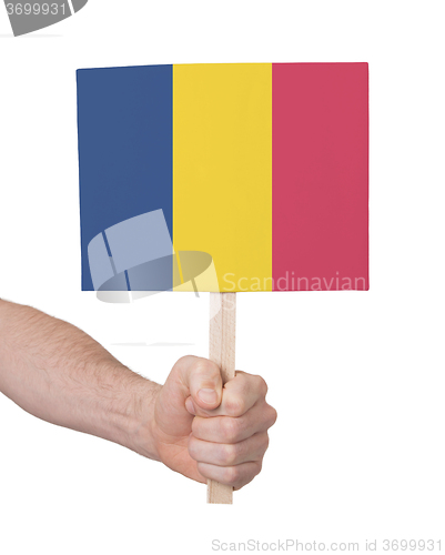 Image of Hand holding small card - Flag of Romania