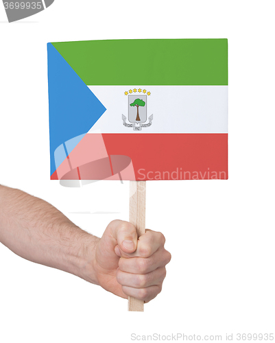 Image of Hand holding small card - Flag of Equatorial Guinea