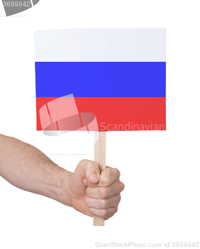 Image of Hand holding small card - Flag of Russia