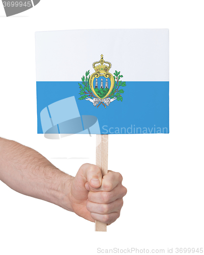 Image of Hand holding small card - Flag of San Marino