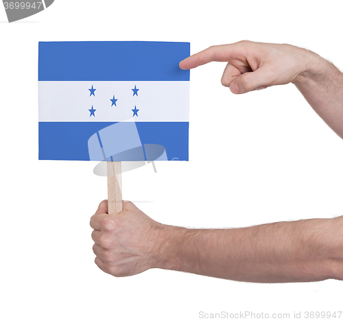 Image of Hand holding small card - Flag of Honduras