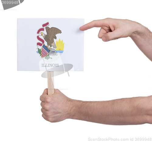Image of Hand holding small card - Flag of Illinois