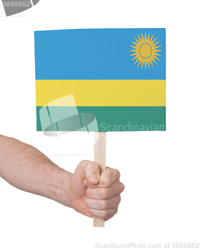 Image of Hand holding small card - Flag of Rwanda