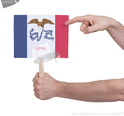 Image of Hand holding small card - Flag of Iowa