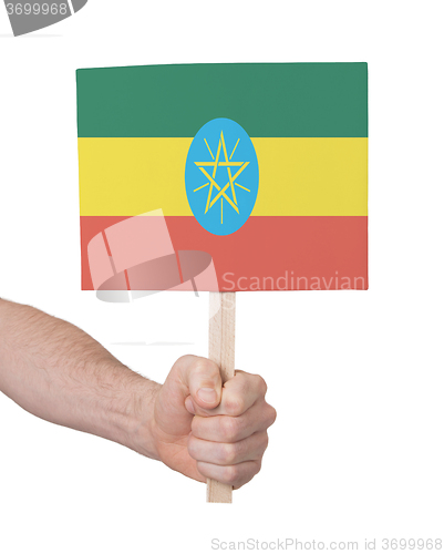 Image of Hand holding small card - Flag of Ethiopia