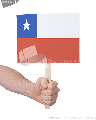 Image of Hand holding small card - Flag of Chile