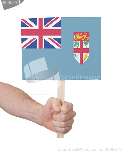 Image of Hand holding small card - Flag of Fiji