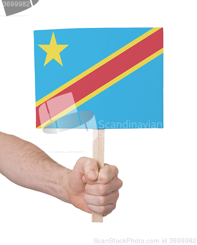 Image of Hand holding small card - Flag of Congo