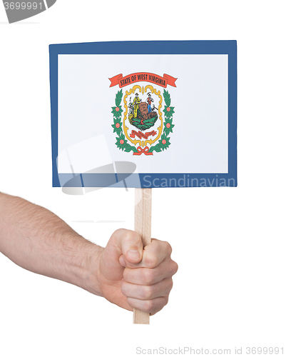 Image of Hand holding small card - Flag of West Virginia