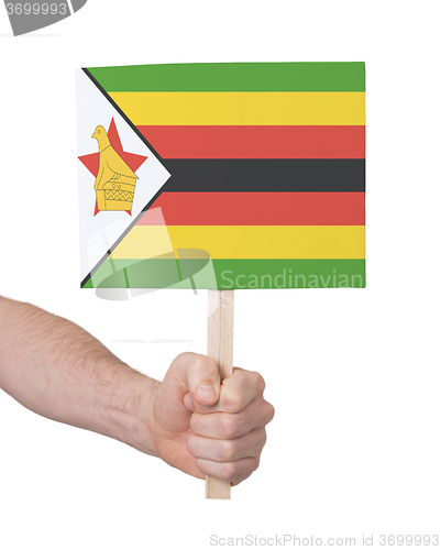 Image of Hand holding small card - Flag of Zimbabwe