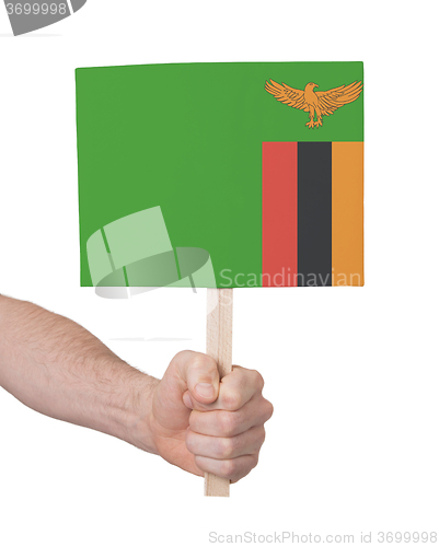 Image of Hand holding small card - Flag of Zambia