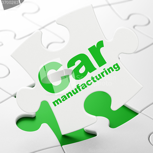 Image of Manufacuring concept: Car Manufacturing on puzzle background