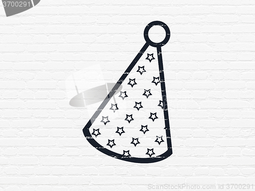 Image of Holiday concept: Party Hat on wall background