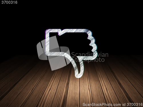 Image of Social media concept: Thumb Down in grunge dark room