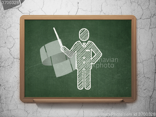 Image of Learning concept: Teacher on chalkboard background