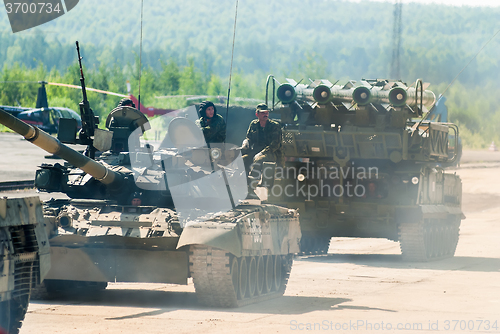 Image of Convoy of T80U tank and Buk-M1-2 in motion. Russia