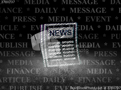 Image of News concept: Newspaper in grunge dark room
