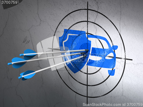 Image of Insurance concept: arrows in Car And Shield target on wall background
