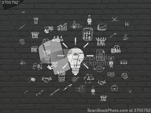 Image of Business concept: Light Bulb on wall background